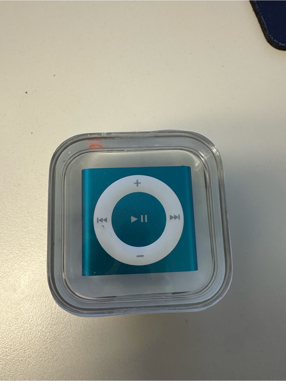 New, Unopened Apple iPod shuffle 2GB in Teal and Clear Case,